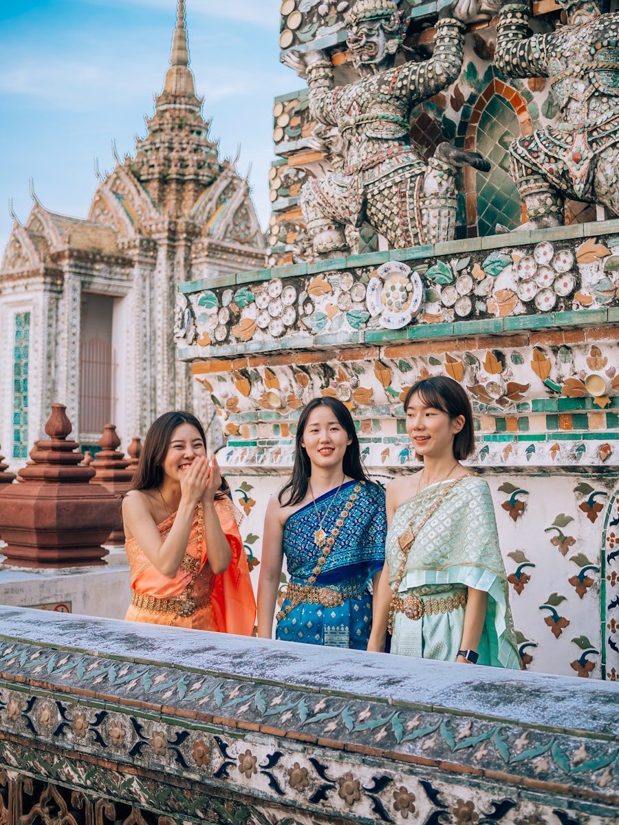 Women in traditional Thai dress at Wat Arun in Bangkok
